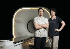 Two Technologists in front of digital pet scanner