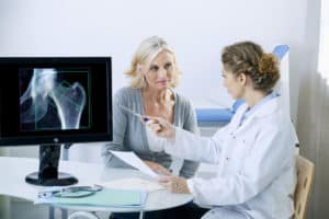 Technologist discussing Bone Density exam with patient